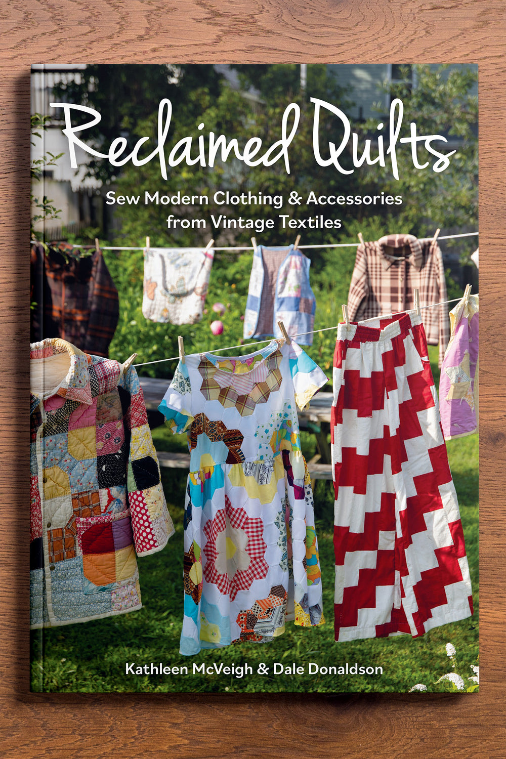Front Cover of Reclaimed Quilts, Sew Modern Clothing & Accessories From Vintage Textiles Book Written By Kathleen McVeigh and Dale Donaldson